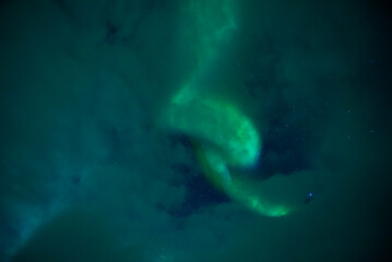 Fototapeta na wymiar aurora borealis between clouds 