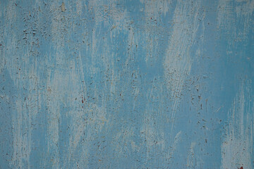 Texture of white and blue old peeling paint. Texture of two layers of old cracked paint on an even metal surface with traces of rust, high resolution.