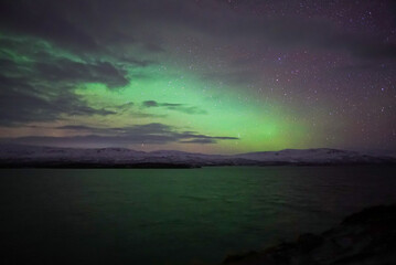 Naklejka na ściany i meble aurora borealis over the sea