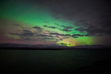 Naklejka na ściany i meble landscape with northern lights and clouds