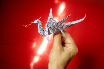 Origami paper dragon. High Angle View Of Dragon Origami. Paper folded origami polygonal geometric...