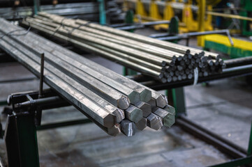 A bundle of hexagonal metal bars, steel mill products