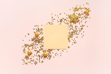 Christmas composition. Golden frame mockup on pink background. Copy space. Holiday concept.