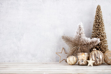 Obraz na płótnie Canvas Christmas gold stars. Christmas decoration. Background on the gray color.