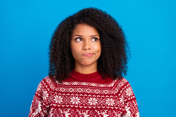 Photo of unsure pretty lady wear print pullover looking empty space isolated blue color background