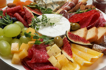 Set of different delicious appetizers on plate, closeup
