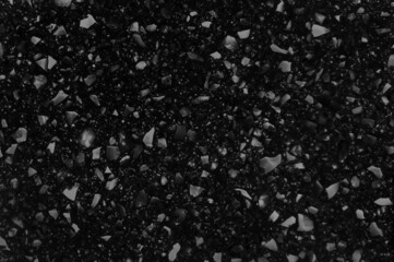 black quartz surface for bathroom or kitchen countertop. close up artificial stone showing stone...