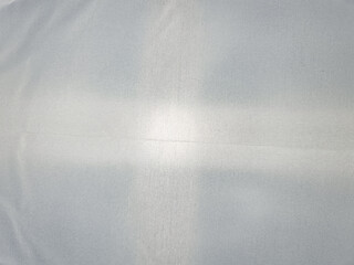 The White fabric background. White material background.