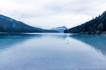 Lake in the Herzogstand peak, mountains. Bavaria Lake Walchensee on a rainy and foggy morning, day. European alps in Germany, Europe Bavarian Prealps