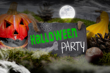 Black slate chalkboard with happy halloween and trick or treat pumpkin decoration with fog