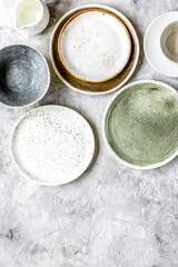 ceramic tableware top view on stone background mock up