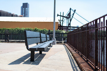 Empty Wood Benches at a Park along the Shore of the East River in Astoria Queens in New York City