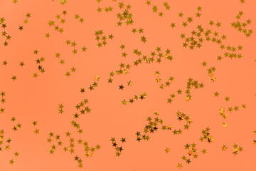 Flying gold stars glitter red backdrop. Magic shining. Christmas and New Year holiday