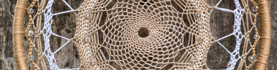 banner of Handmade dream catcher with feathers threads and beads rope hanging