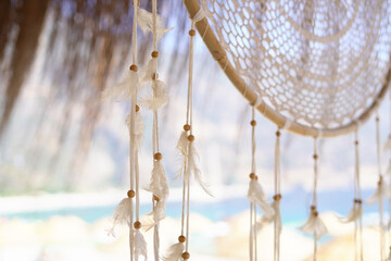 Dreamcatcher on the background of the sea on a turkish sandy beach