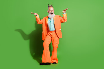 Full length body size view of attractive cheerful funky granddad dancing wearing crown isolated...