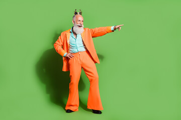 Full length body size view of attractive cheerful man dancing in crown having fun isolated over...