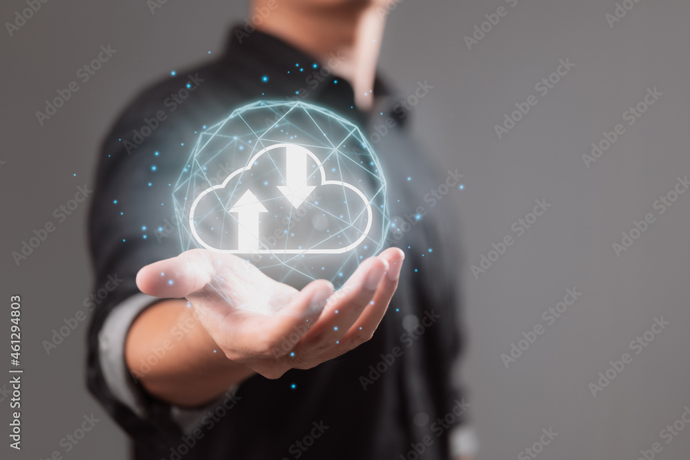 Leinwandbilder A businessman holds and provides virtual cloud computing with copy space in order to transfer data information and upload and download applications. The concept of technological transformation.