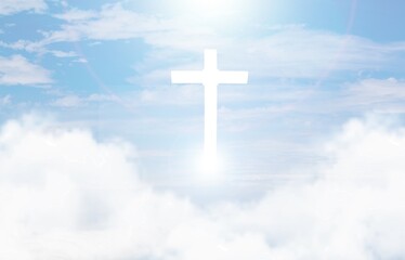Christian cross appears bright in the sky background and clouds.