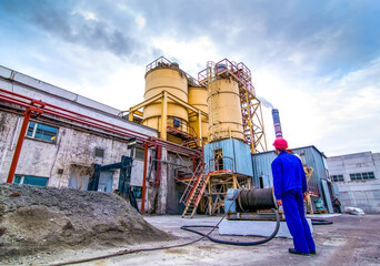  Brick Factory Production - workman in front of mixing tower