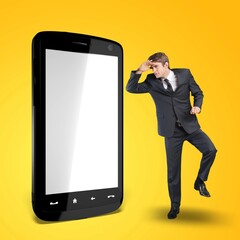 Excited Man with Big Smartphone With Blank White Screen And Gesturing Sign,