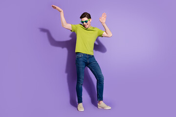 Full length body size view of attractive cheerful guy dancing fooling isolated over bright violet purple color background