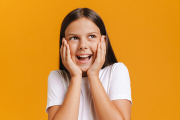 White brunette girl wearing t-shirt smiling while looking aside