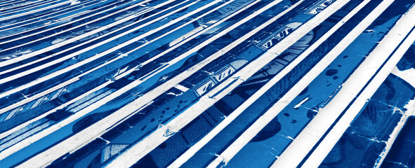 Old comic books stacked in a pile with blue monotone color background texture