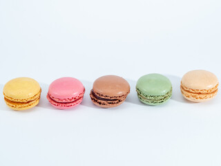 colorful macarons on white background