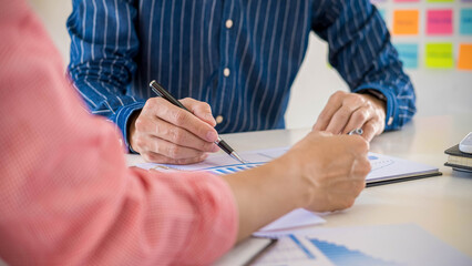 Obraz premium Start up partners are discussing the ideas for new strategy of development.