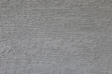 Grey wall texture or background, rough plastered concrete wall