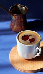 cup of Turkish coffee with copper coffeepot