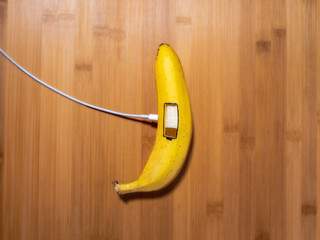 Banana battery - wood as a background, free energy, the concept of gaining free energy, ecology.