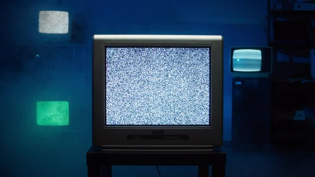 Retro old televisions on blue neon background. Collection of ancient, old-styled vintage TV with grey screens, bad signal reception, ripples and interference, cinematography concept.
