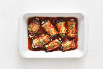 Baked eggplant rolls with tomato sauce and cheese