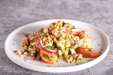 salad of celery tomatoes red onions and nuts