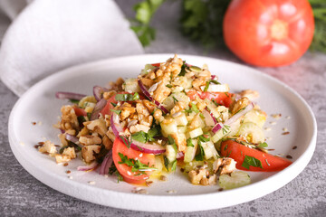 salad of celery tomatoes red onions and nuts