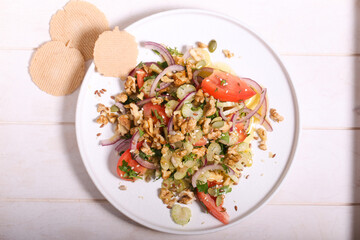 salad of celery tomatoes red onions and nuts