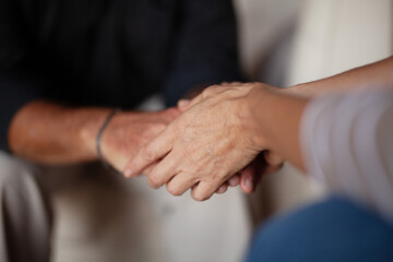 Cancer diagnosis. Hands holding other hands. Consultation with a psychologist. Hope and kindness.