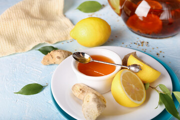 Tea, lemon, honey and ginger healthy on the light background