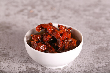 sun-dried tomatoes in oil are on the table