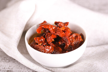 sun-dried tomatoes in oil are on the table