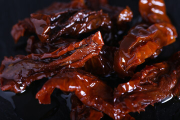 sun-dried tomatoes in oil are on the table