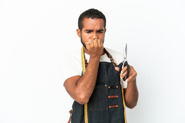 Young Ecuadorian design man holding scissors isolated on white background having doubts