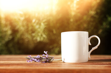 Tea cup on wooden table outdoors