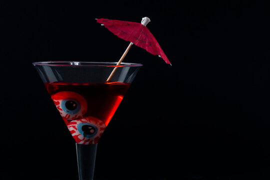 Cocktail with eyes and umbrella for the craziest evening.