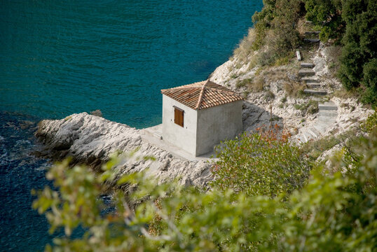 Small building on Karst rocks of Adriatic Sea near Duino, Italy