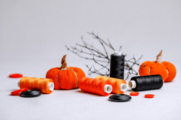 A set for creativity for Halloween in black and orange colors. Decorative threads and buttons on...