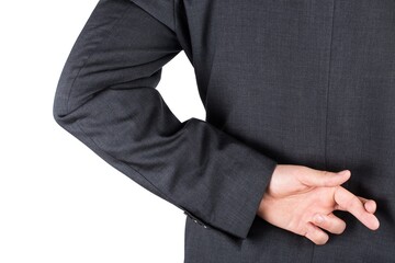 Fingers crossed behind the back