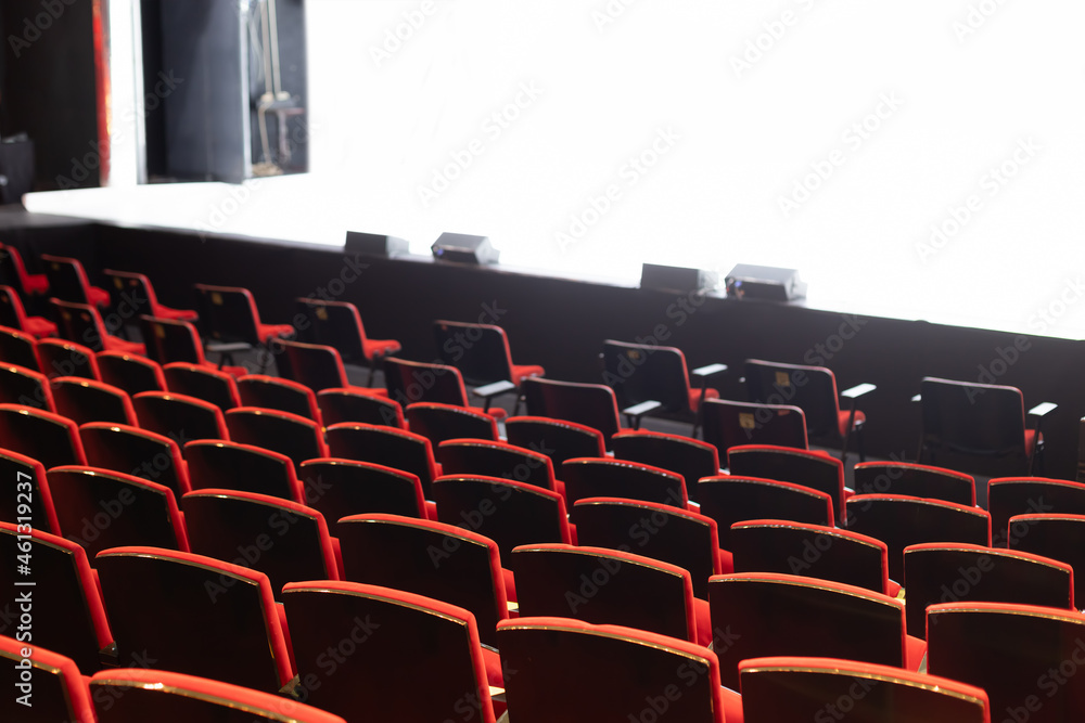 Wall mural empty theater seats with white background